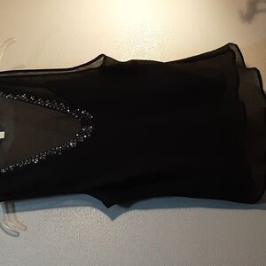 Looking for a dressy shell? Black shear camisolle with sequined neckline.